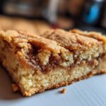 Close-up of a rich, golden Cookie Butter Blondie with a visible swirl of cookie butter.