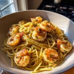 A bowl of Garlic Herb Shrimp Scampi, featuring perfectly cooked shrimp and spaghetti tossed in a light, flavorful sauce.