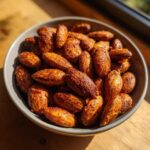 A bowl of delicious Smoky Paprika Almonds, seasoned with spices and ready to eat.