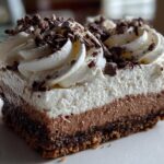 Peppermint Mocha Cheesecake Bars with Whipped Cream