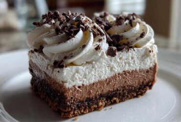 Peppermint Mocha Cheesecake Bars with Whipped Cream