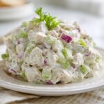 A perfect mound of Classic Chicken Salad for Sandwiches, featuring diced chicken, celery, and red onion in a creamy dressing.
